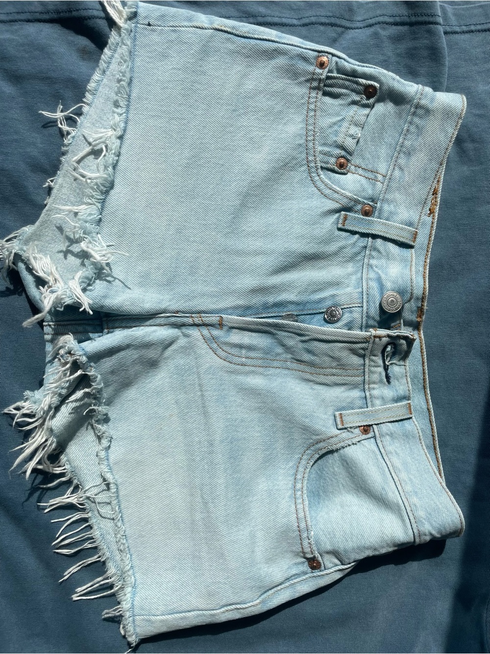 Levi's Pale Blue Frayed Denim Cutoff Shorts